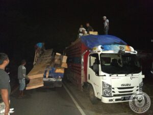 Moving the wood of an old traditional Toraja house to transport