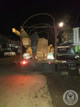 Moving the wood of an old traditional Toraja house to transport
