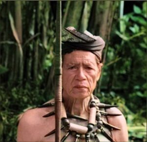 Nenek Tulian in priestly dress for a funeral.