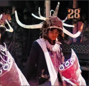 Men parading in warrior dress.